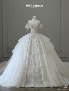 a white wedding dress on display with the words hey couture written above it