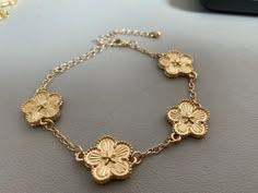 Really gorgeous gold flower charm bracelet Looks stunning when worn  adjustable size  Great quality!  Handmade  Free delivery 2000s Jewelry, Gold Flower Bracelet, Beaded Wedding Jewelry, Prom Jewelry, Gold Charm Bracelet