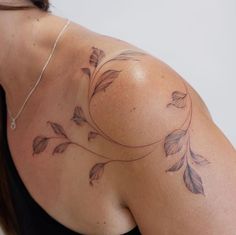 a woman with a tattoo on her shoulder