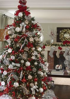 a christmas tree decorated with silver and red ornaments