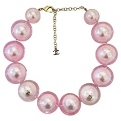 Rare Item - Chanel Ltd Edition 'CC' Logo Pearl Choker Necklace Oversized baby pink faux pearl choker encased in clear resin and detailed with gold 'CC' logo embellishments. Adjustable lobster clasp and a dangle chain with 'CC' logo. From Summer 2017 Collection. Size – One Size Condition – Very Good Composition – Faux Pearls Comes with – Necklace Only Cher Horowitz Jewelry, Chanel Pearl Necklace, Star Necklace Gold, Chanel Necklace, Chanel Pearls, Pink Chanel, Pearl Choker Necklace, Pierced Jewelry, Chanel Vintage