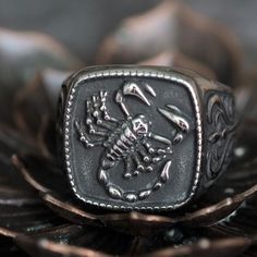 Introducing our Antique Silver Stainless Steel Scorpion Ring for Men, a bold and durable accessory that exudes edgy style.  Crafted from high-quality stainless steel, this ring features an intricately designed scorpion motif in an antique silver color, adding a vintage touch to your look. Here's what makes this ring stand out:  - Edgy Scorpion Design: Embrace your fearless spirit with the detailed scorpion motif, making a daring statement on your finger.  - Antique Silver Finish: The vintage col Durable Silver Stainless Steel Jewelry, Sturdy Stainless Steel Jewelry For Gifts, Sturdy Stainless Steel Jewelry As A Gift, Tarnish Resistant Silver Stainless Steel Rings, Durable Silver Jewelry Gift, Durable Stainless Steel Jewelry For Gift, Durable Silver Metal Ring, Adjustable Silver Titanium Rings, Durable Silver Promise Ring