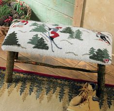 a wooden bench with a foot rest on top of it in front of some plants