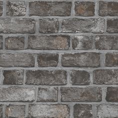 an old brick wall is shown in grey tones