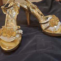 Gold Stiletto Sandals With Rhinestones And Crystals Brand New! Never Been Worn! However Please Note In The Pictures, That Though They Have Been Well Taken Care Of And Protected, There Is A Little Lifting Inside On The Soles, Towards The Back. This Is Probably Due To The Florida Heat And Humidity. If You Have Super Glue Or Shoe Glue Then You're All Set. The Price Will Reflect This Too. Gold Sandals With Rhinestones And Open Heel, Gold Heels With Rhinestones, Open Heel Style, Gold Bling Heels For Summer, Elegant High Heel Sandals With Rhinestones, Formal High Heel Sandals With Rhinestones, Formal Embellished High Heel Sandals, Spring Formal Bling Sandals, Bling High Heels For Formal Occasions, Formal High Heels With Bling