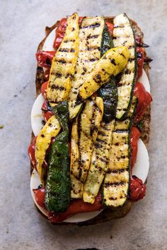 a grilled sandwich with zucchini and tomatoes