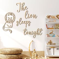 the lion sleeps tonight wall decal in a children's room with bookshelves and toys