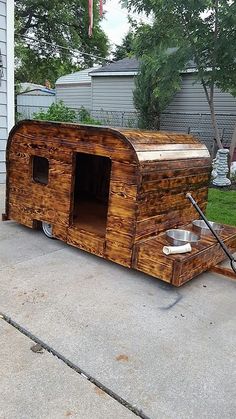 an old trailer converted into a dog house