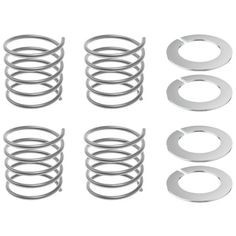 an assortment of springs and washers on a white background