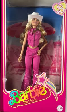 the barbie doll is wearing pink pants and a white cowboy hat with stars on it