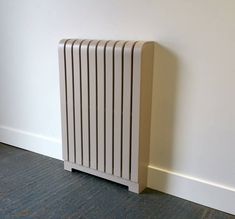 a white radiator sitting next to a wall