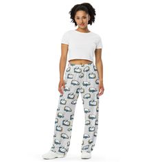 Upgrade your loungewear with our All-Over-Print Unisex Wide-Leg Pants, designed for ultimate comfort and style. These best-selling pants effortlessly blend fashion with function, making them perfect for everything from cozy pajamas to trendy streetwear. Whether you're lounging at home or stepping out, their super soft, stretchy fabric ensures comfort in every move. Crafted with premium knit mid-weight jersey fabric, these pants feature a relaxed unisex fit and an adjustable elastic waistband with a white drawstring for added comfort. Plus, the practical side pockets make them ideal for daily wear. Choose to wear them on the waist or hips for a customizable fit. The fabric's OEKO-TEX 100 standard certification guarantees safe, eco-friendly material that's gentle on the skin. Whether you're Casual Sleepwear Trousers With Elastic Waistband, Sleepwear Trousers With Pockets For Loungewear, Trousers Sleepwear With Pockets For Loungewear, Comfortable Pants With Elastic Waistband For Pajama Party, Comfortable Elastic Waistband Pants For Pajama Party, Casual Sleepwear Straight Pants For Pajama Party, Casual Sweatpants With Pockets For Sleep, Casual Sleep Pants With Pockets, Casual Sleepwear With Relaxed Fit Trousers