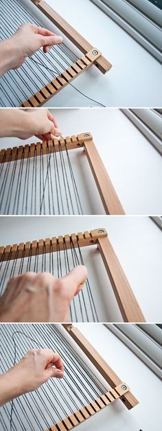 the hands are working on an object that looks like a weaving loom