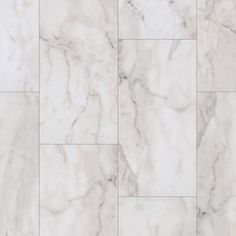 a white marble tile floor with different patterns