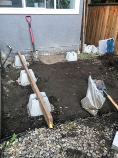 the back yard has been dug up and is ready to be used as a garden bed