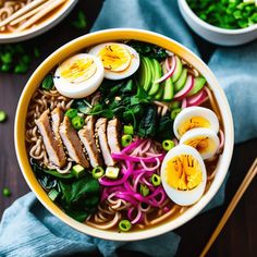 a bowl of ramen with hard boiled eggs and vegetables