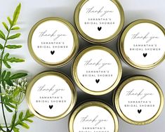 six personalized wedding favors in gold tins