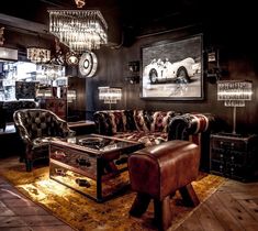 a living room filled with furniture and chandeliers