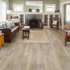 a living room filled with furniture and a fire place