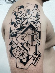 a man's shoulder with black and white ink art work on the upper half of his arm