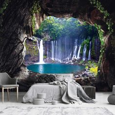 a bedroom with a waterfall wall mural in the background