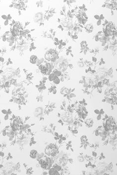 a white and grey floral wallpaper with roses