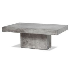 a concrete table sitting on top of a white floor