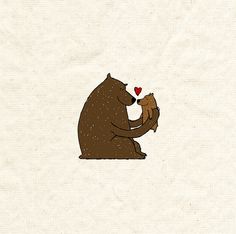 a brown bear holding a red heart in its paws