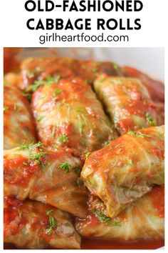 stuffed cabbage rolls with marinara sauce and parsley on top in a white bowl