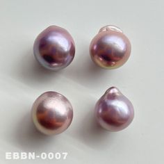 three different types of pearls on a white surface