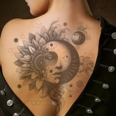 a woman's back with sunflower and moon tattoos on her upper body,