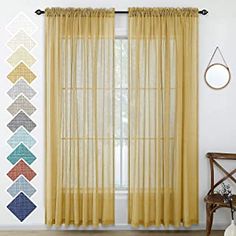 the curtains are hanging on the wall in front of the window with different colors and shapes