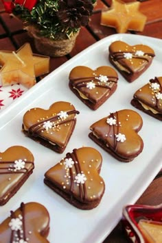 heart shaped cookies are arranged on a platter