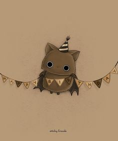 a bat with a party hat on it's head is hanging from a string