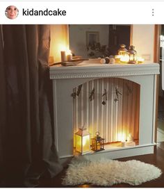 a fireplace with candles on it in a room