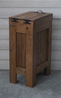 a small wooden box sitting on the ground