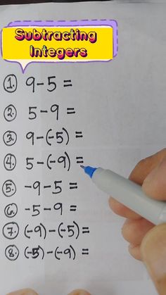 someone is writing numbers on a piece of paper