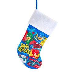 a christmas stocking with the words make heros printed on it, hanging from a blue cord