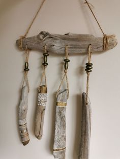 driftwood and rope hanging from the wall