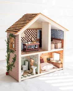 a doll house with furniture and accessories in it