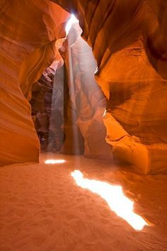 the light shines through an open slot in antelope's desert canyon