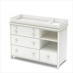 a white baby crib with drawers and changing table in the middle, on a white background