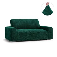 a green couch with a hand reaching for the pillow on it's back and arm