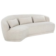 a white couch with four pillows on the back and one arm folded out to show it's curved shape