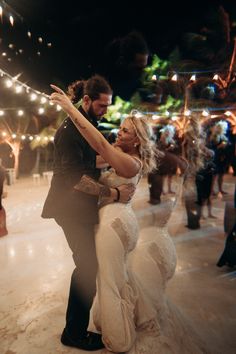 a bride and groom are dancing on the dance floor at their wedding reception in mexico