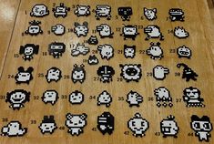 an array of pixel art pieces displayed on a wooden floor with numbers in the middle