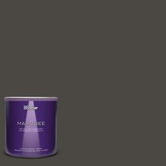 a can of marquee paint on a green background