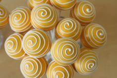 some yellow and white candies in a glass vase