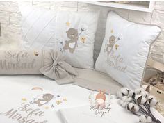 a bed with two pillows and some decorations on it