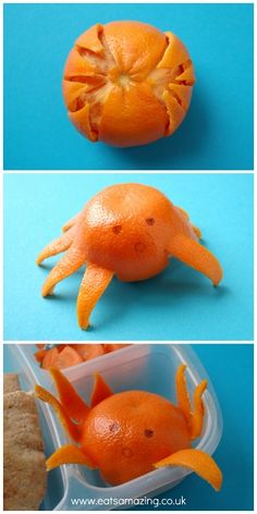 an orange is cut in half and placed inside a plastic container to look like a crab